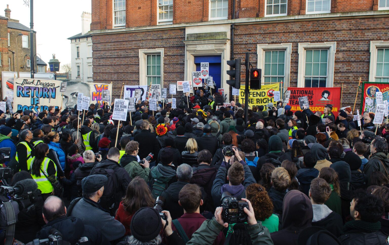 People a vigil in memory of Mark Duggan outside Tottenham Police Station, in Tottenham, north London.